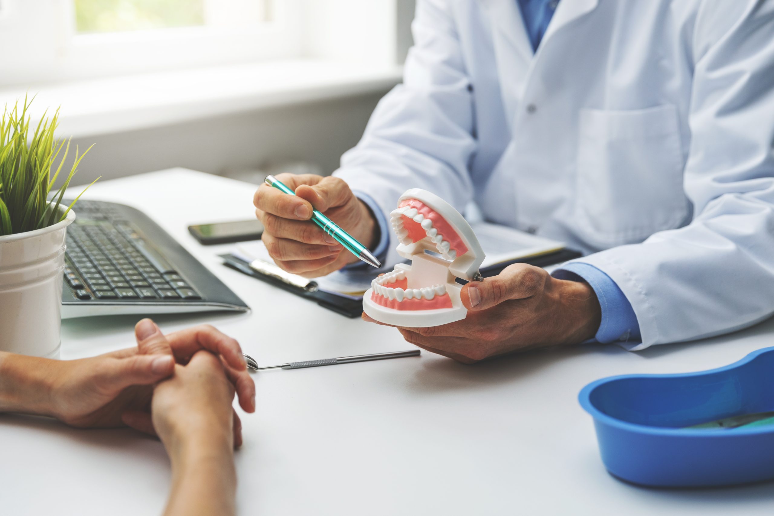 dentist and patient discussion about planned teeth treatment in Dental Examination